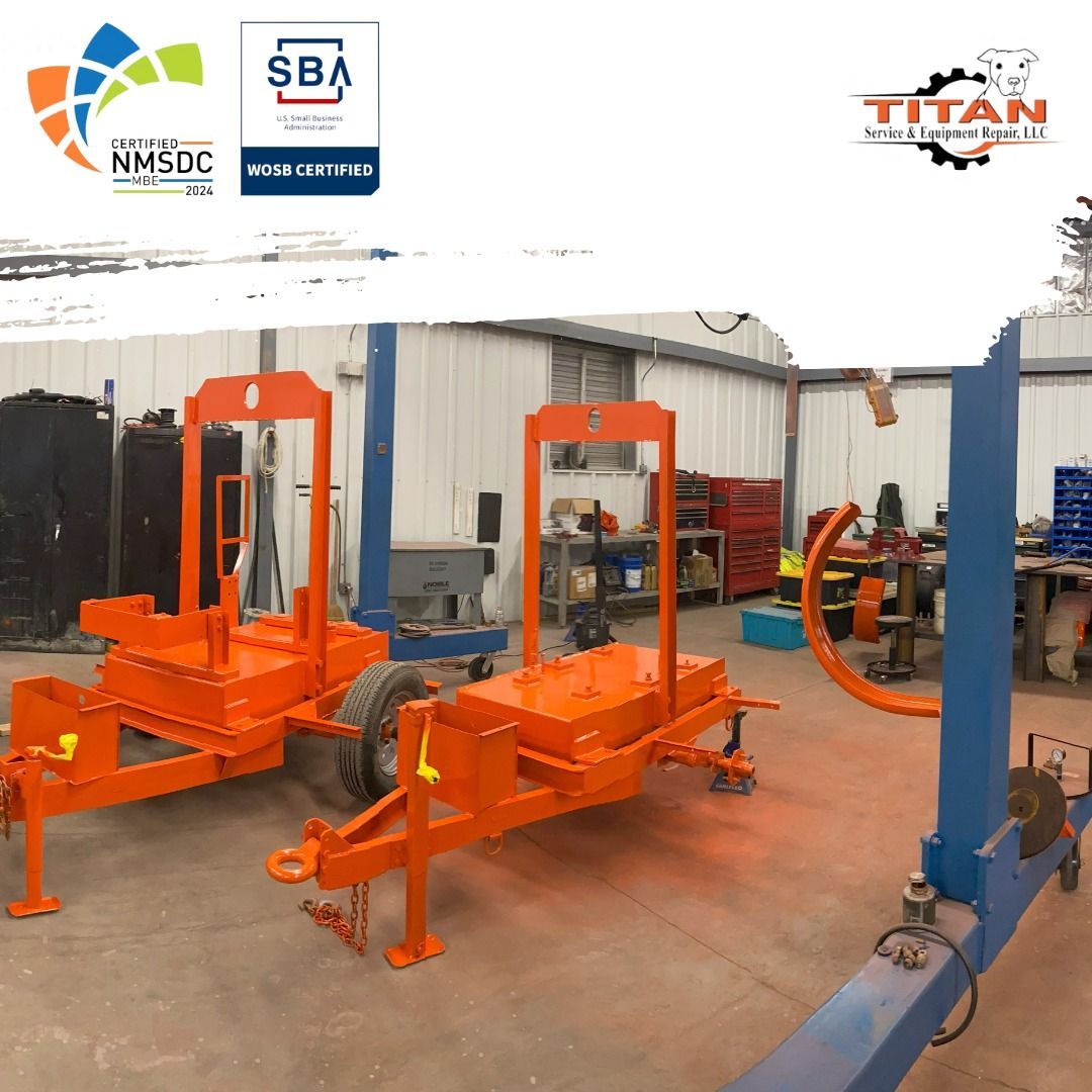 Two orange trailers are in a warehouse with logos for sba and nmsdc