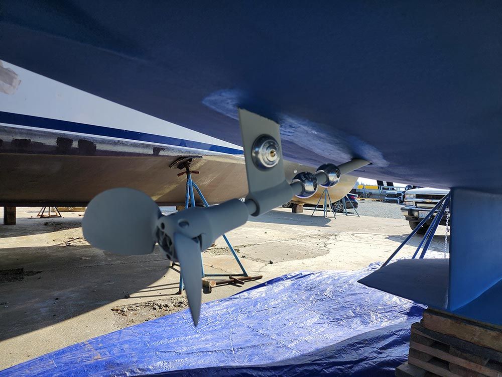 The underside of a boat with a propeller attached to it