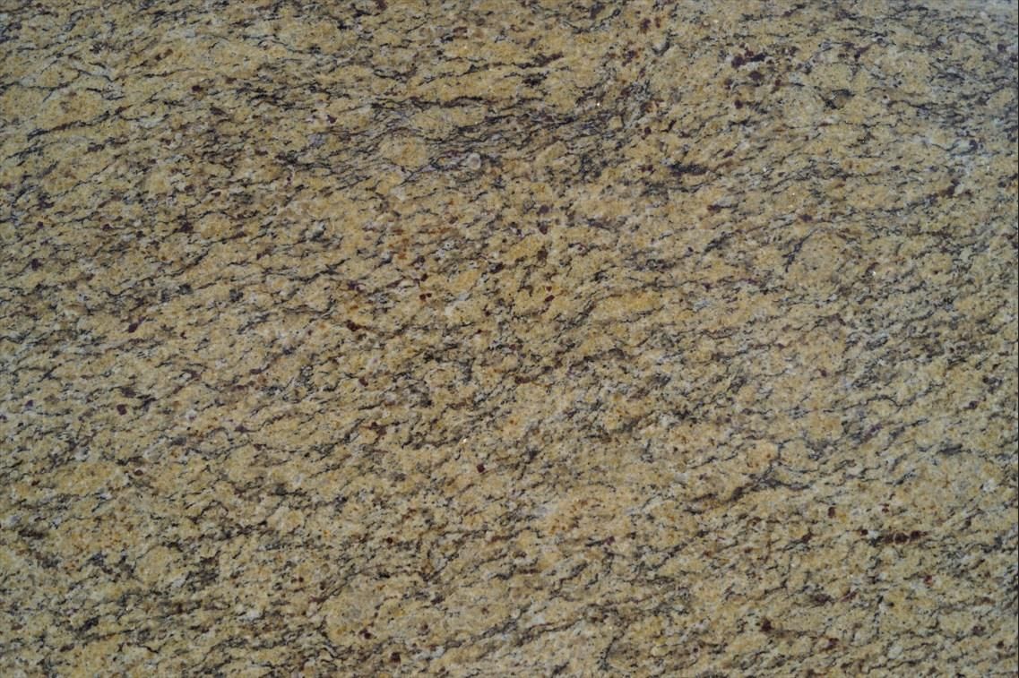 Tan and dark brown speckled granite countertop.