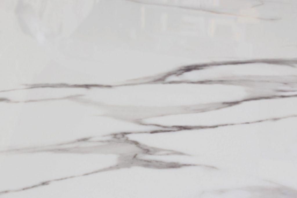 White marble with dark gray veining.