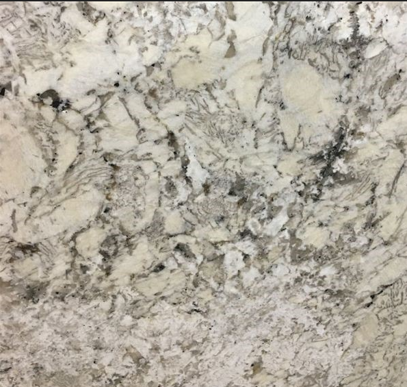 Close-up of granite countertop with white, gray, and black veining patterns.