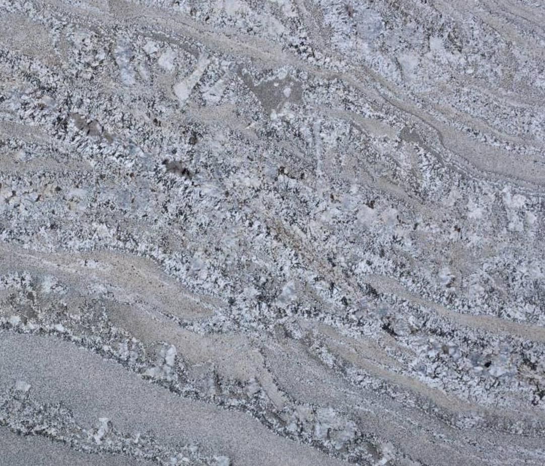 Gray and white granite surface with wavy patterns.