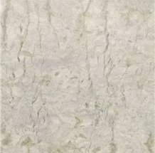 Creamy-white marble surface with subtle veining and texture, suitable for flooring or wall applications.
