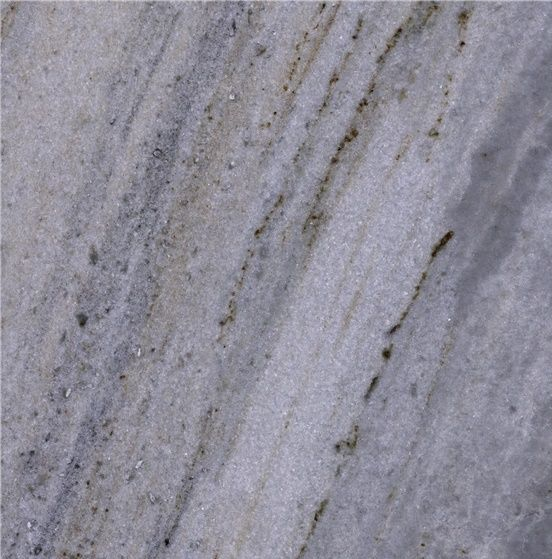 Close-up view of a light gray marble surface with dark, irregular streaks.
