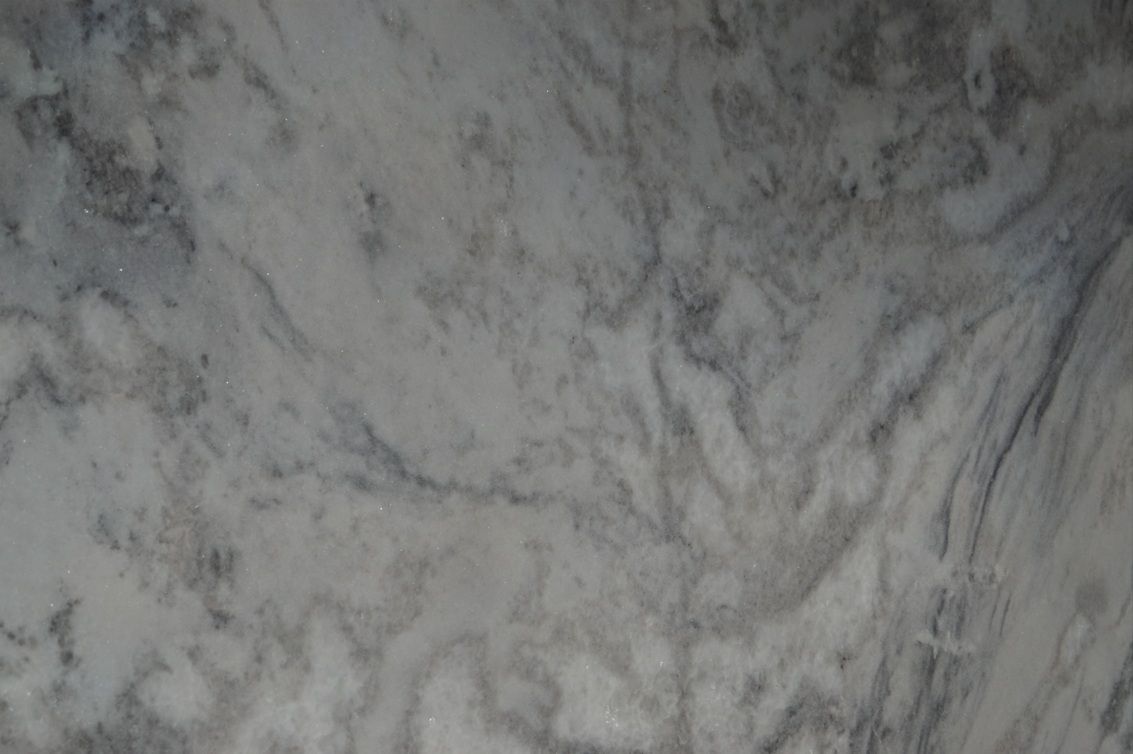 Swirling gray and white marbled surface.