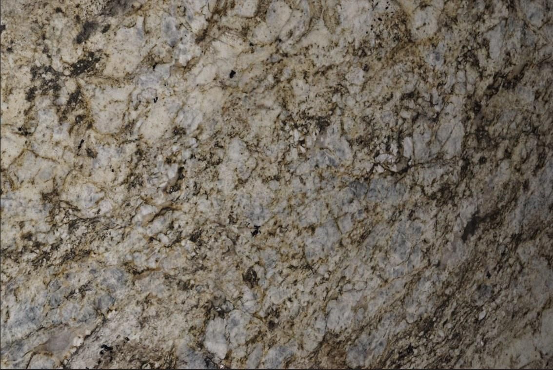 Cream, beige, and brown granite countertop with mottled patterns and textures.