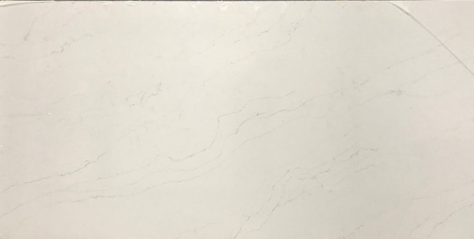 Cream-colored countertop with subtle grey veining and a light, smooth texture.