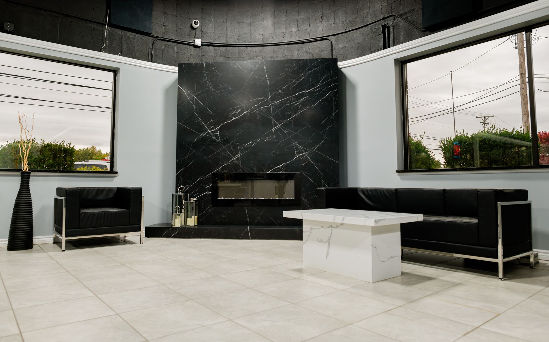 Modern lobby with black marble fireplace wall