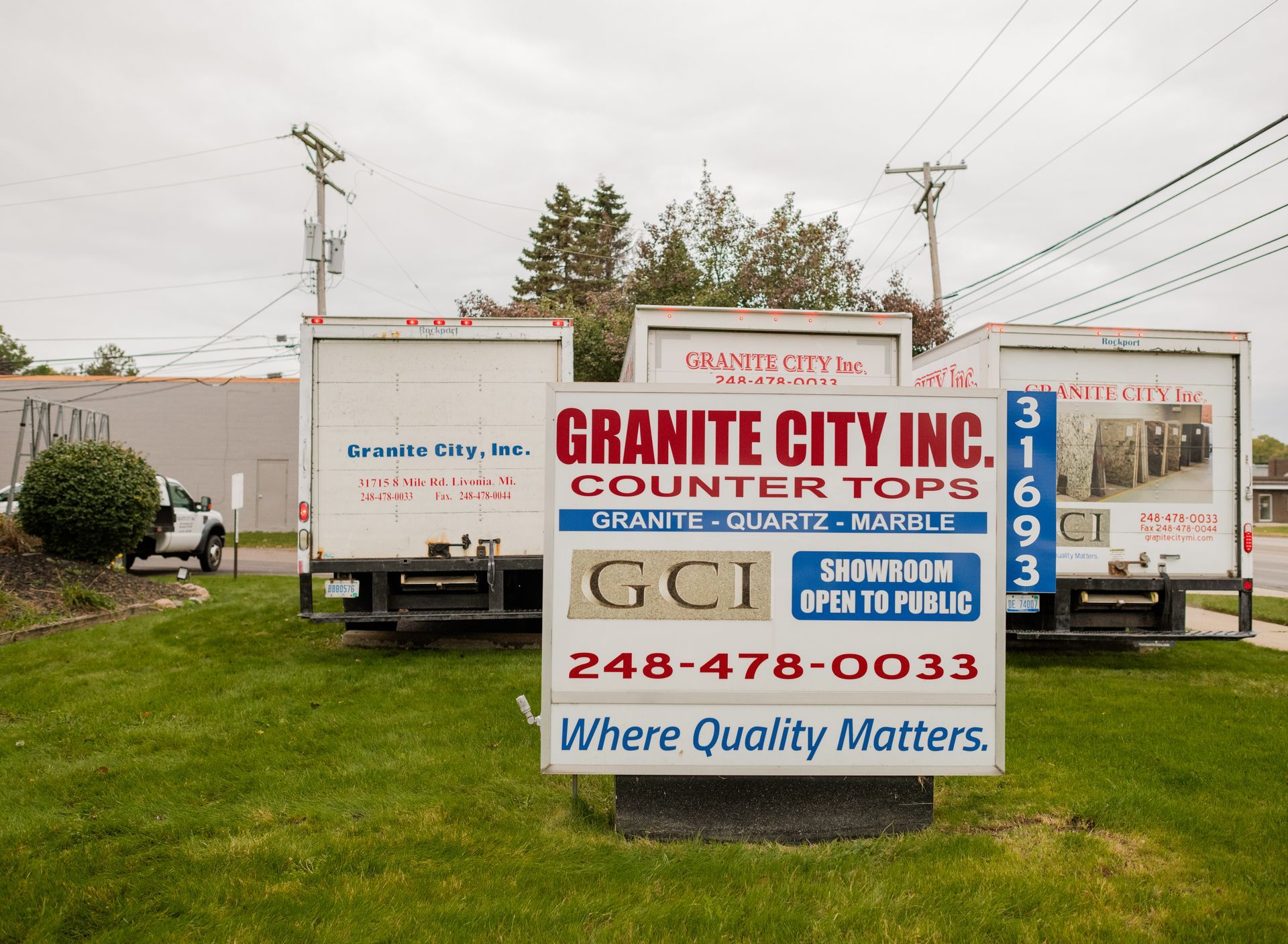 Granite City Inc's sign on a grassy lot