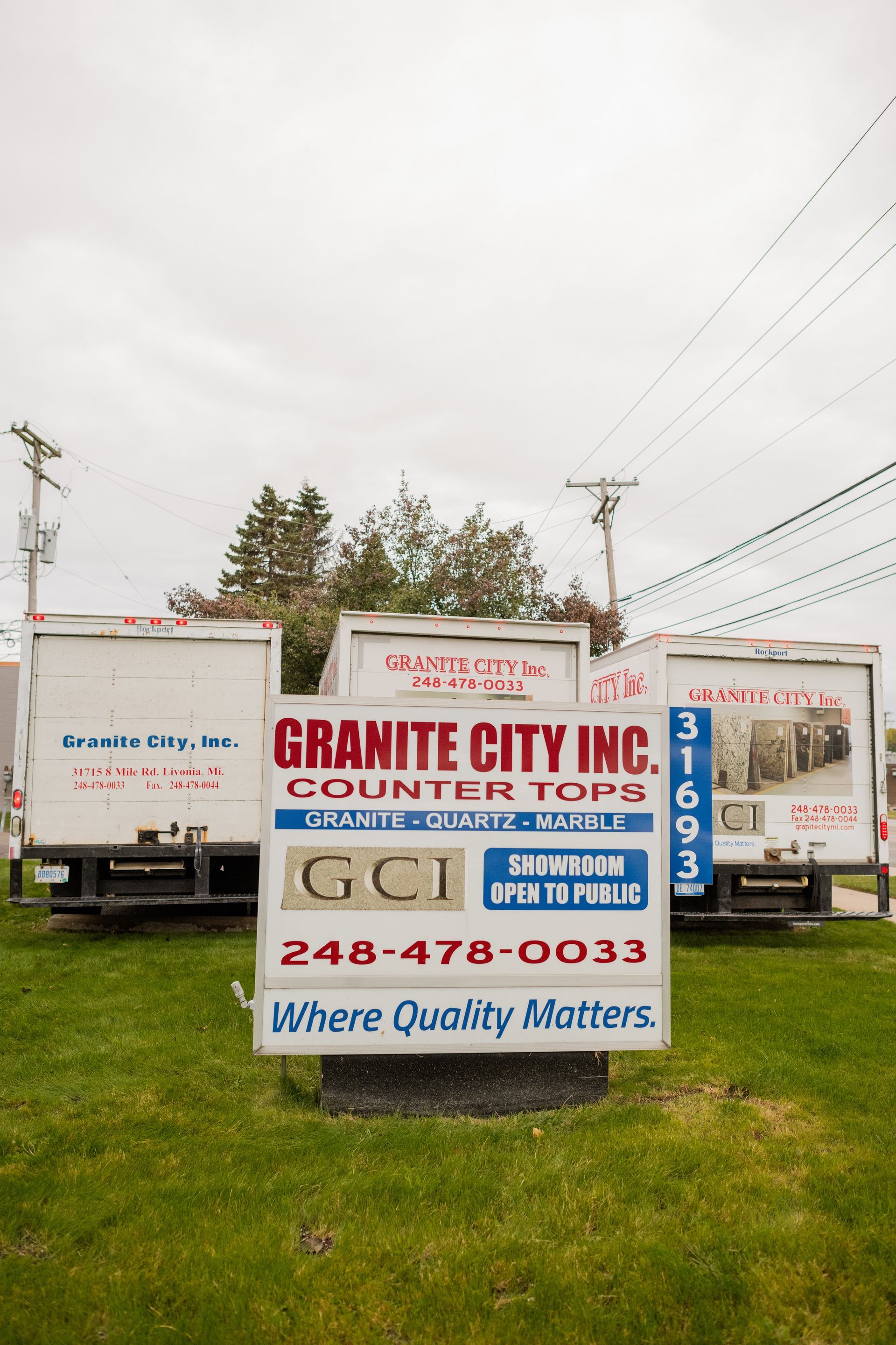 Granite City Inc's sign on a grassy roadside