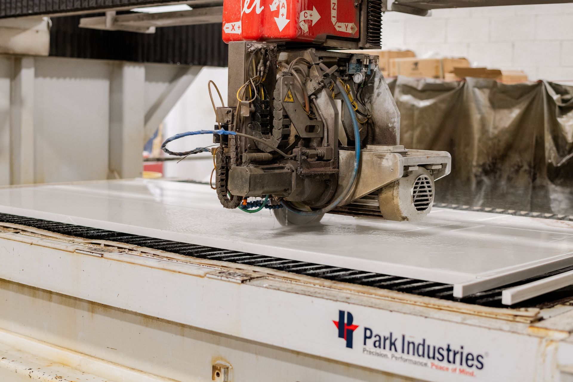 Industrial machine cutting material in a workshop