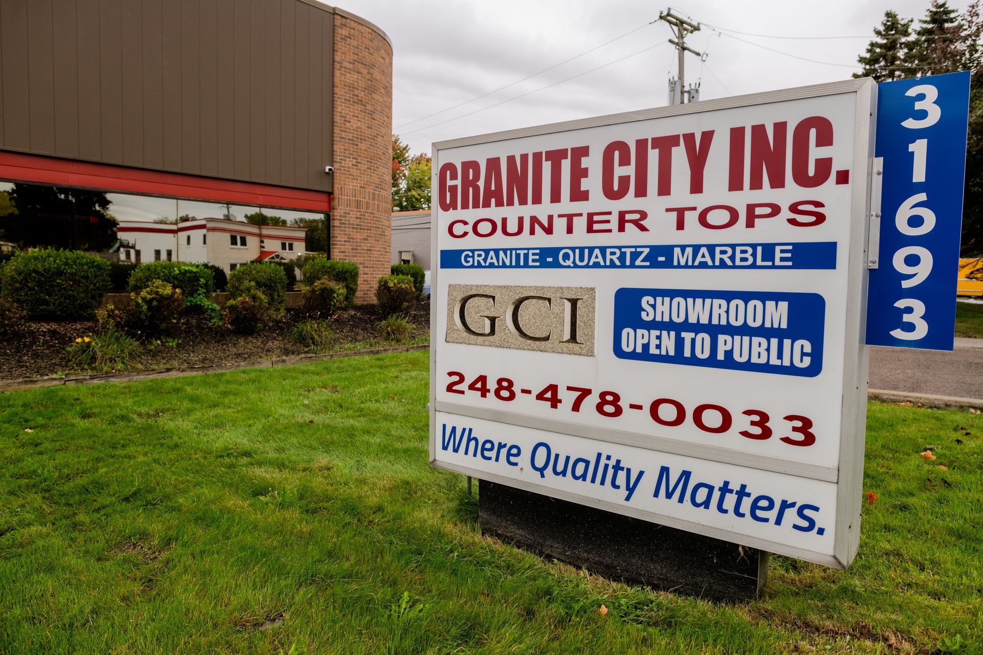 Granite City Inc countertop store sign with showroom and phone number