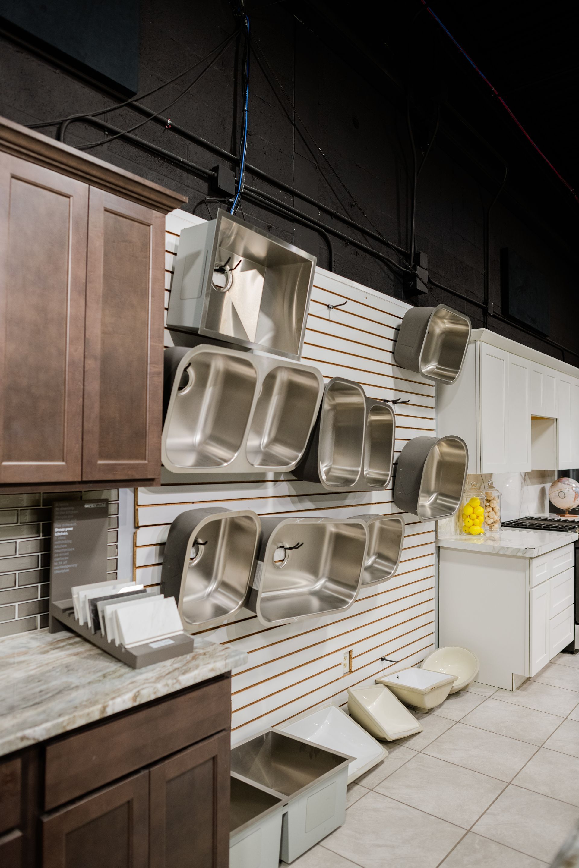 Sample kitchen sinks in a showroom