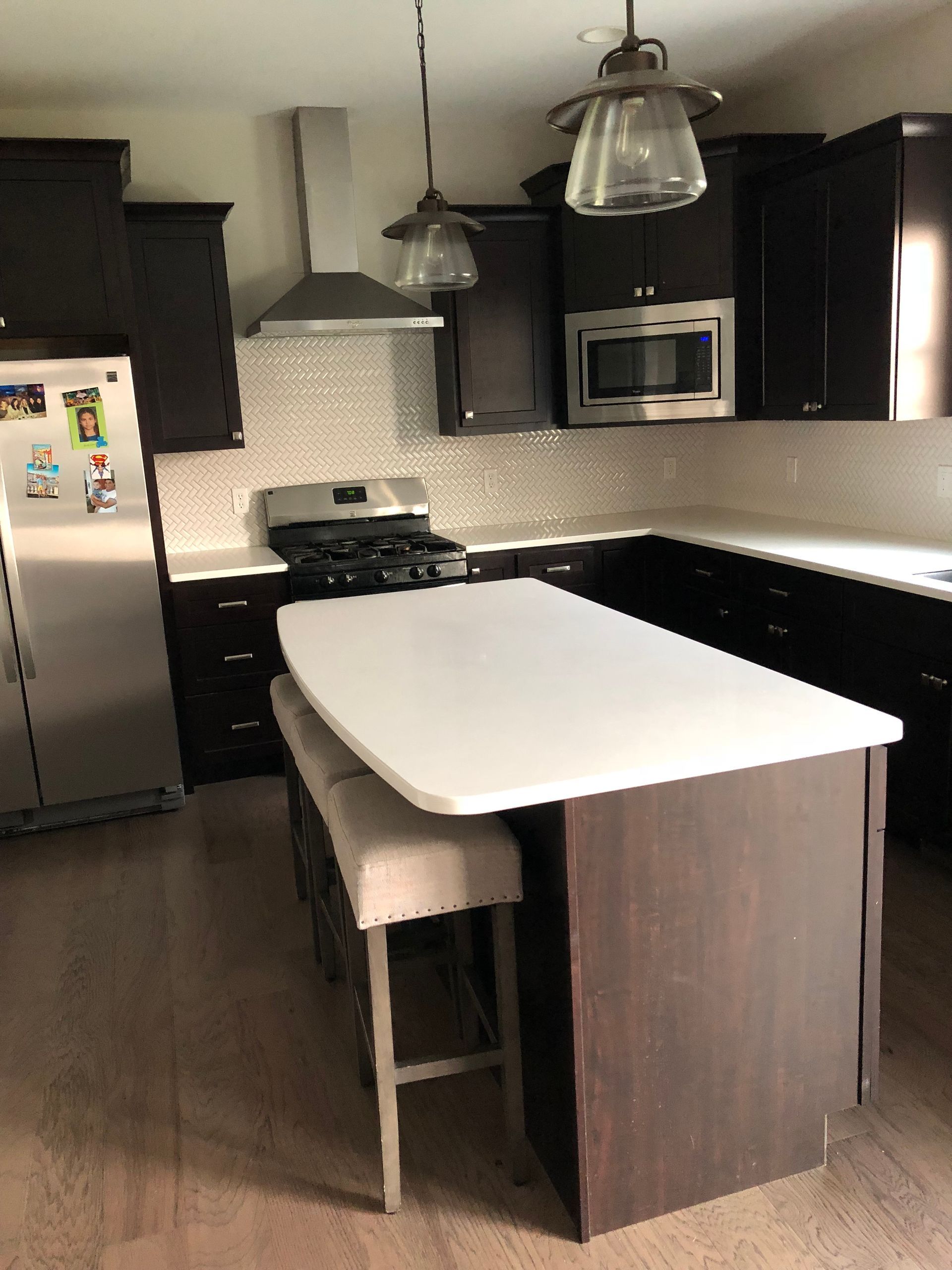 A kitchen with a large island in the middle of it