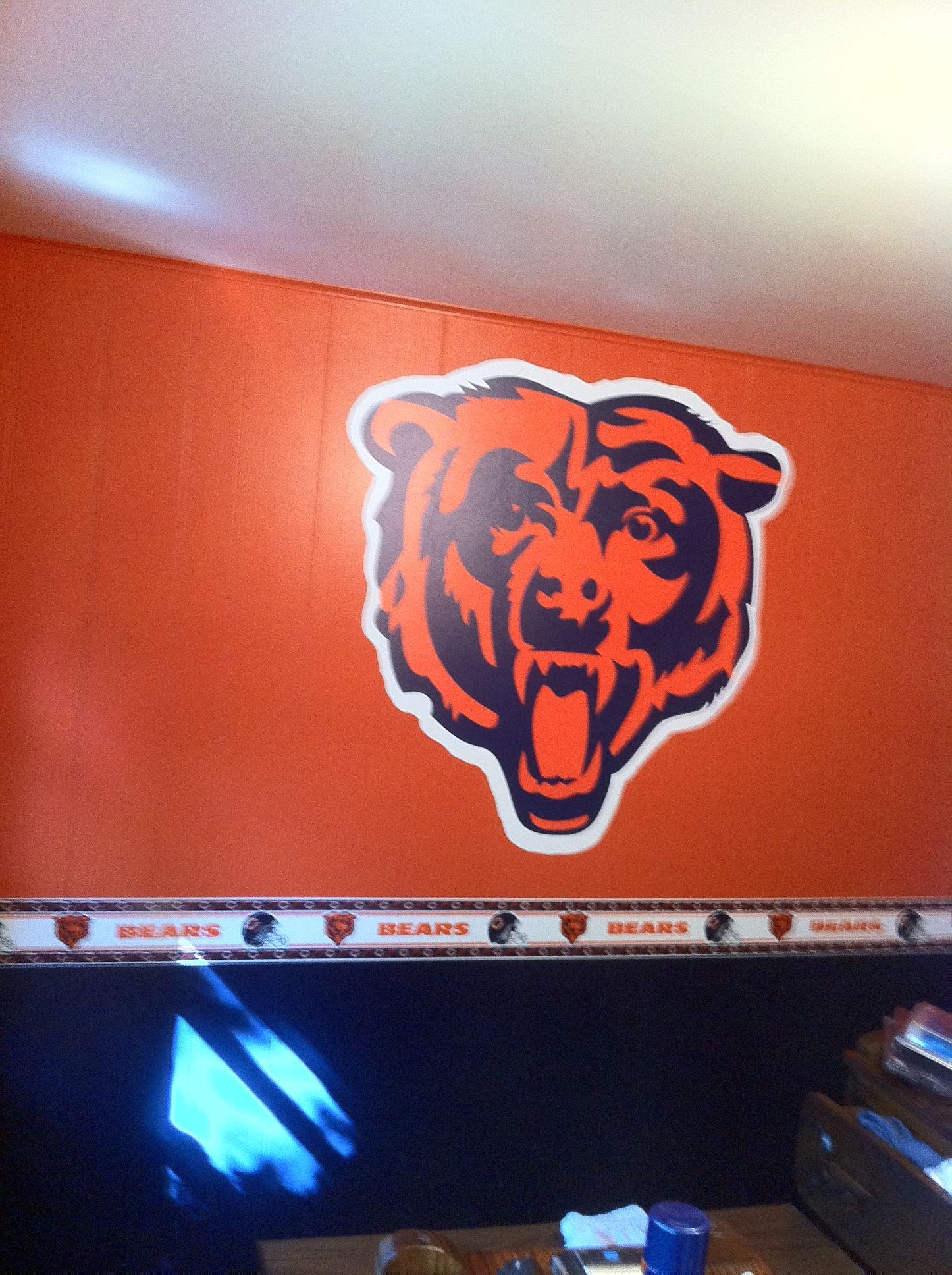 A chicago bears logo is painted on a wall