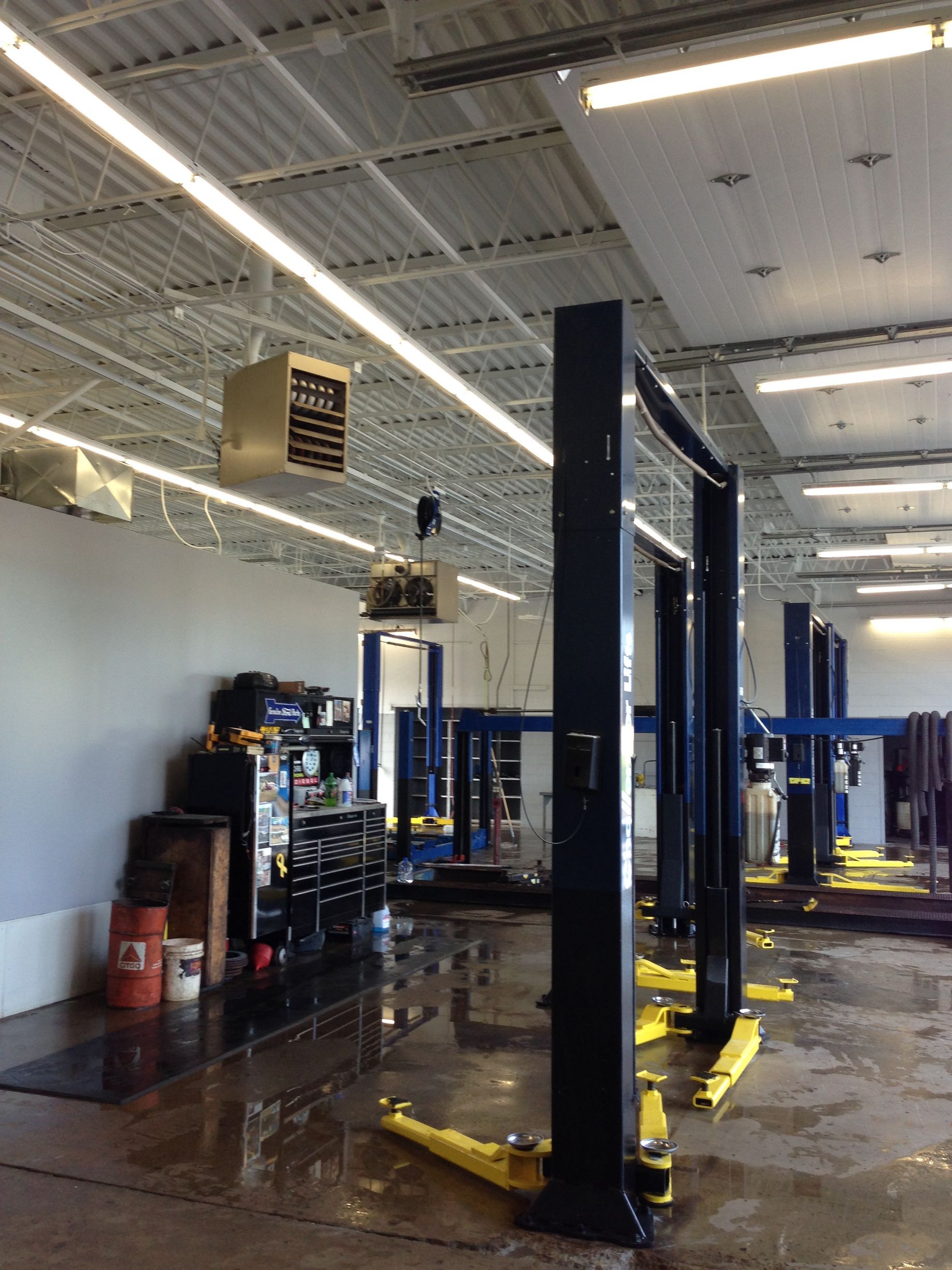 A garage with a lot of lifts in it