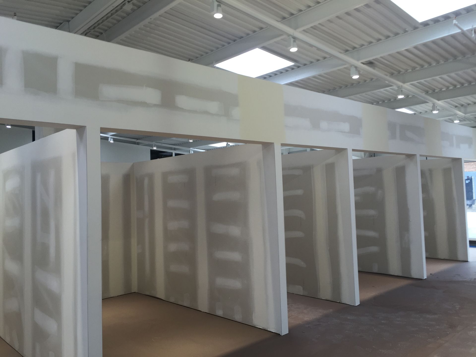 A room with a lot of drywall walls and a ceiling