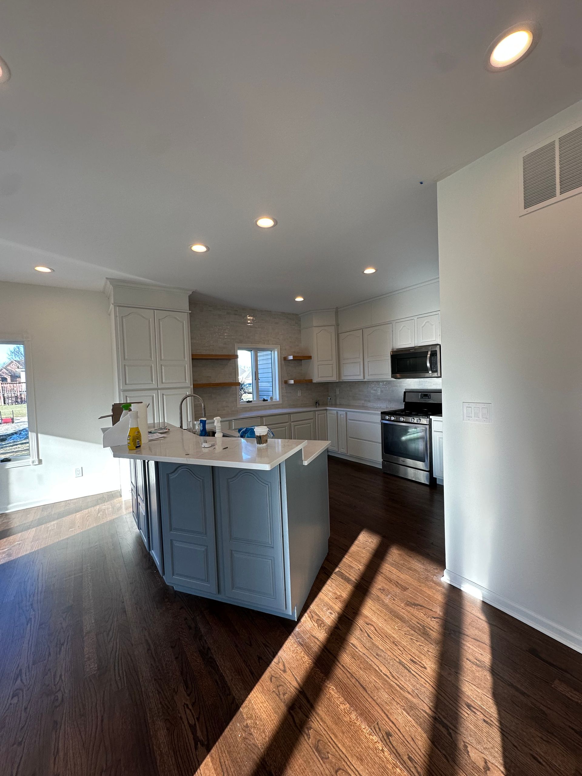 A kitchen with a large island in the middle of the room.