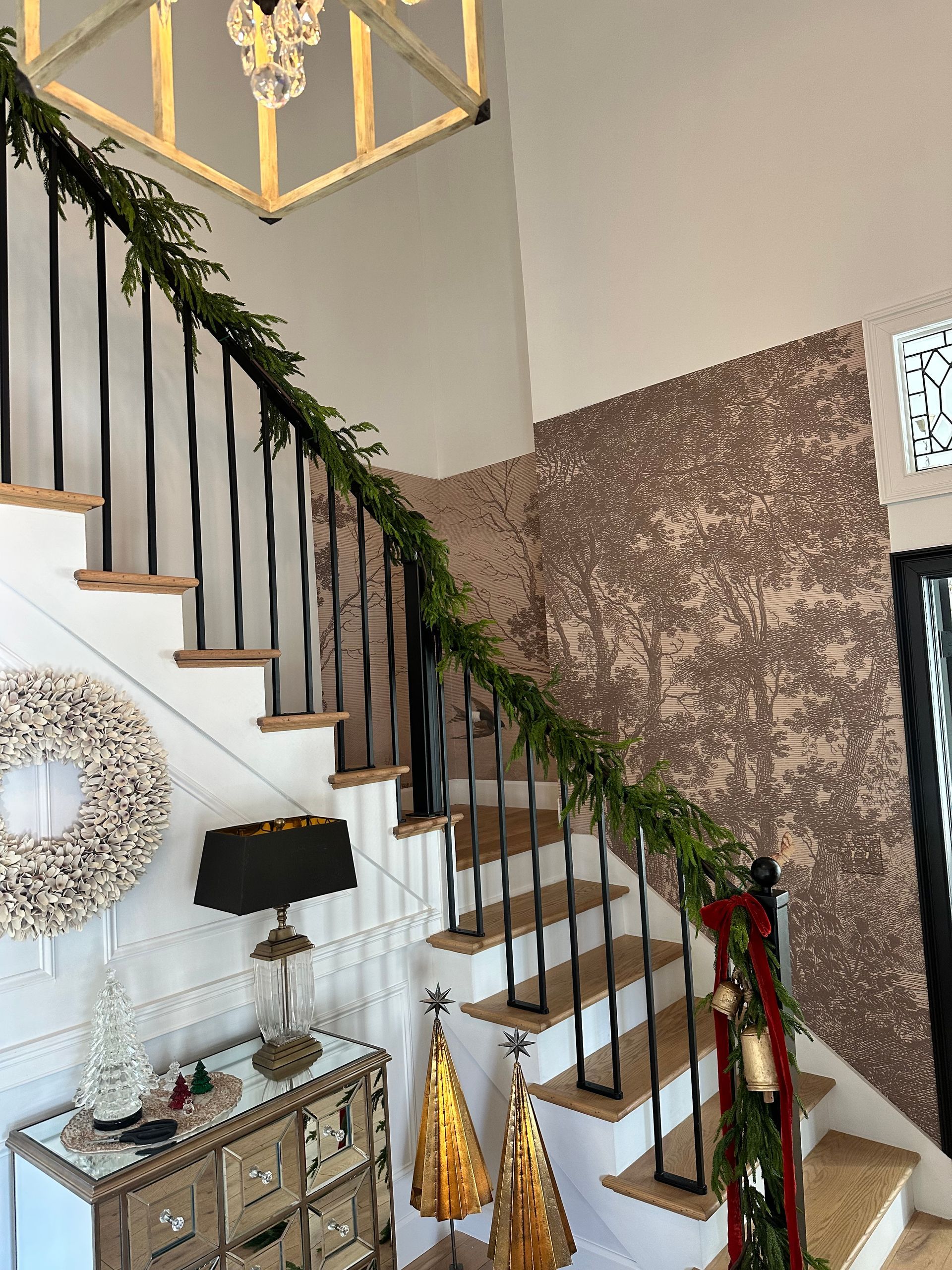 A staircase in a house decorated for christmas