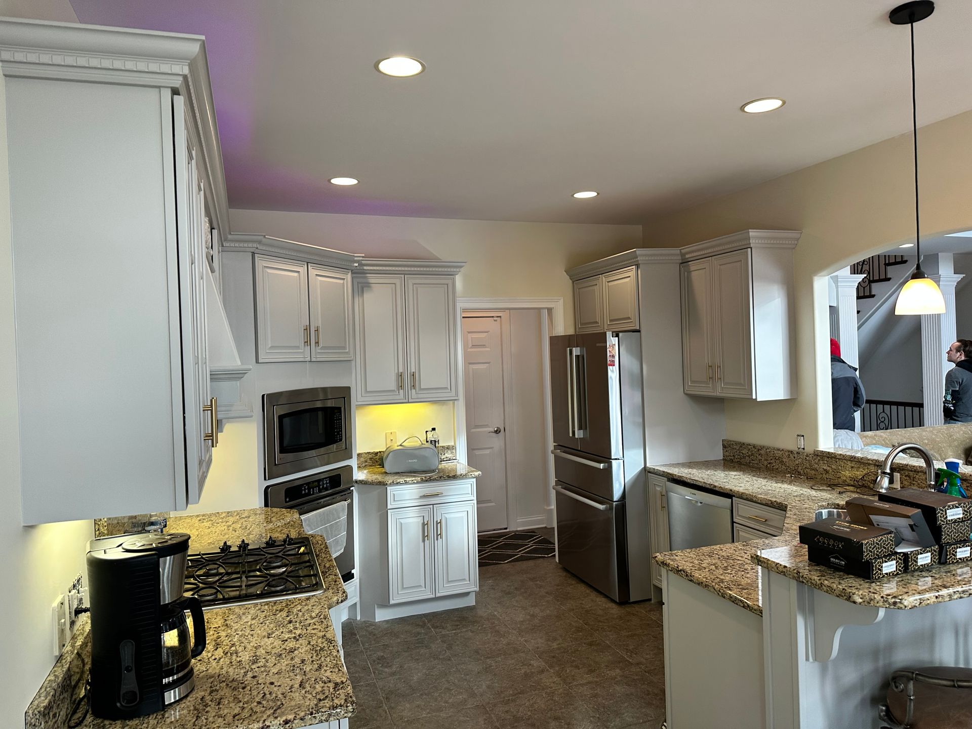 A kitchen with stainless steel appliances and granite counter tops