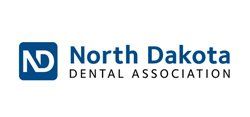 The north dakota dental association logo is blue and white on a white background.