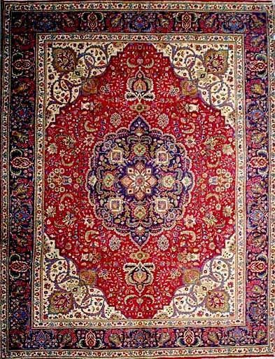 Red Persian rug with a central medallion and ornate floral patterns.