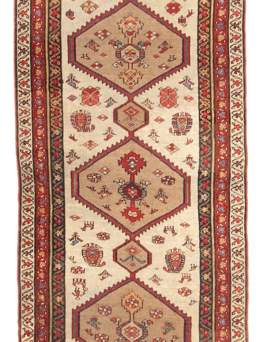 Narrow, beige and red patterned rug with diamond and floral designs.