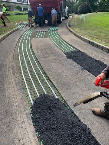 The Bouchard Construction Inc experts working on a driveway