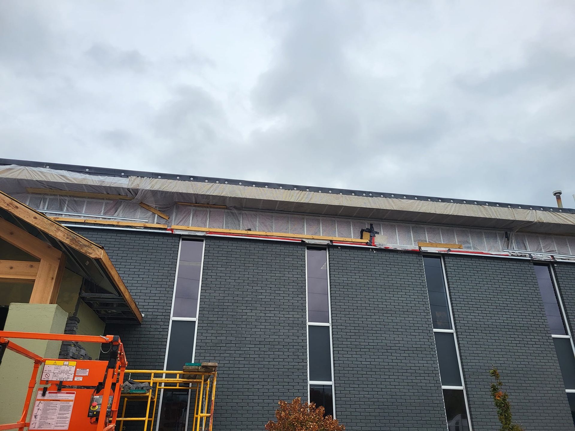 A large building with a lot of windows is being built.
