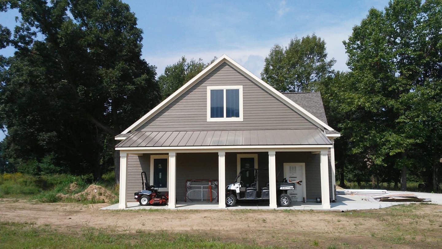 A house with a golf cart parked in front of it