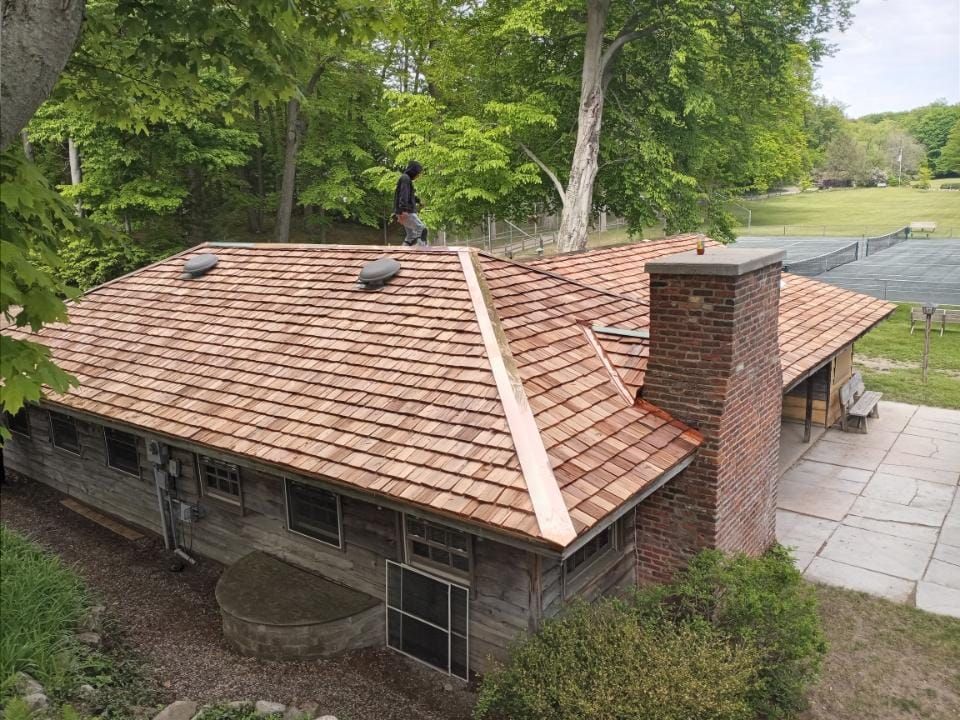 An aerial view of a house with a copper roof.