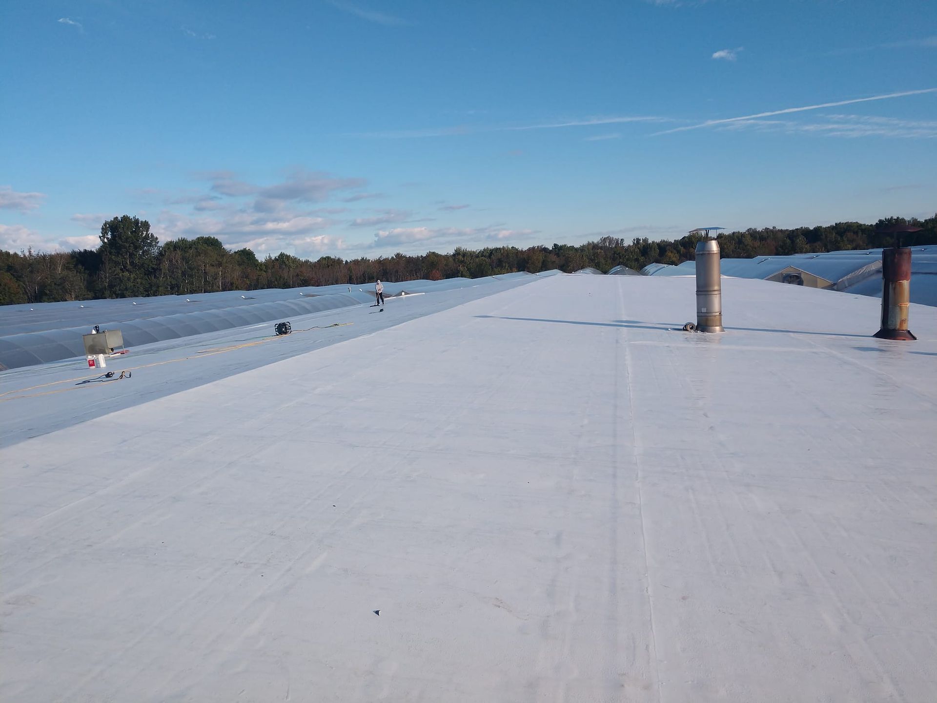 A white roof with a blue sky in the background.