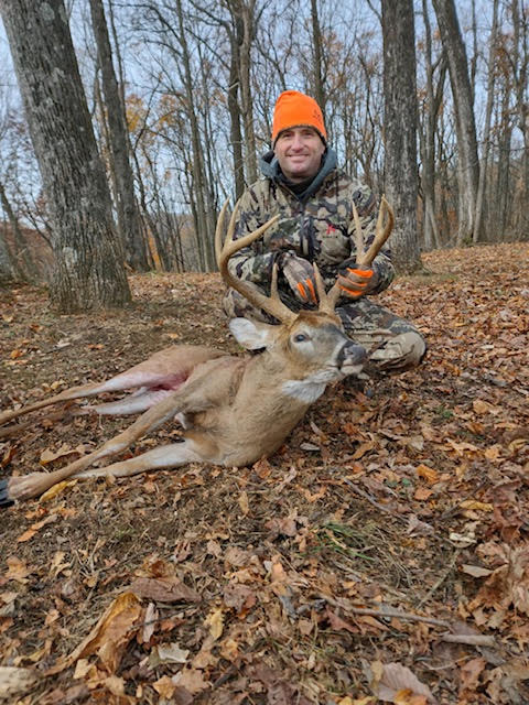 Dog and man in the woods