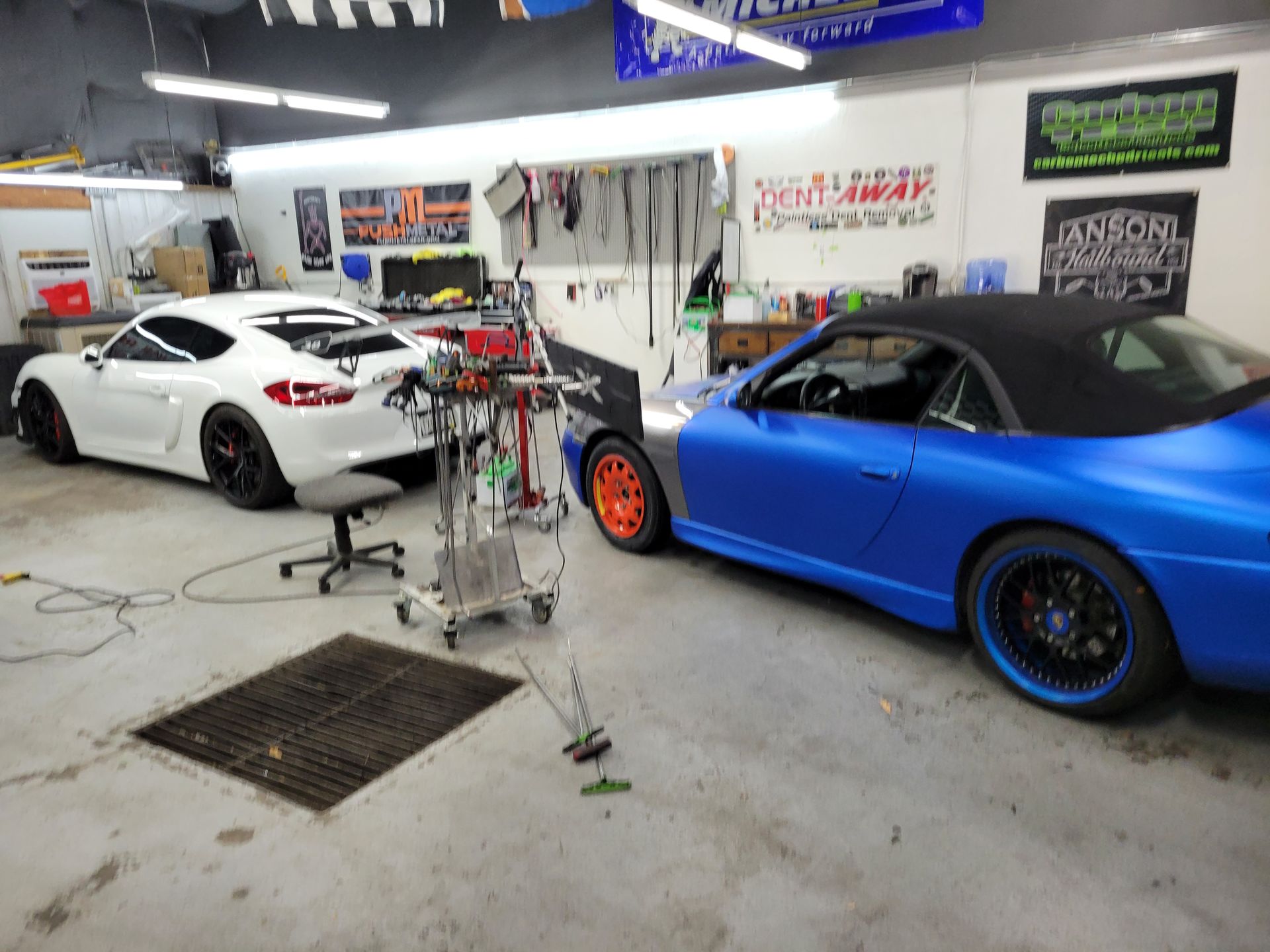 2 cars in the repair shop