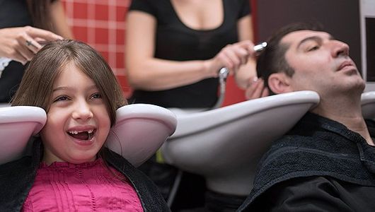 Father and daughter bonding in a salon