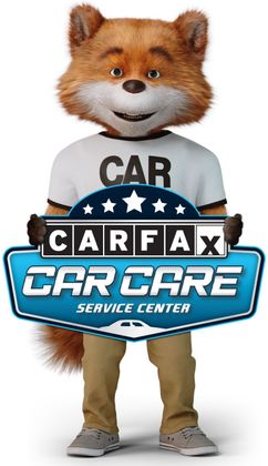 Foxy mascot holding a CARFAX Car Care Service Center sign