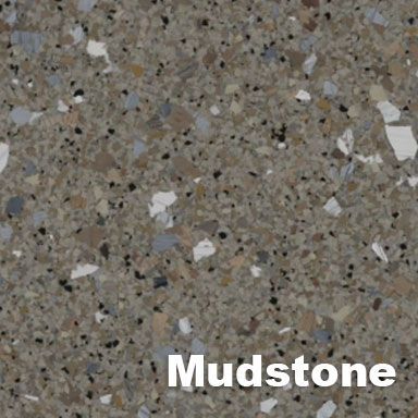 Close-up of a speckled, gray-brown Mudstone stone pattern with various colored flecks.