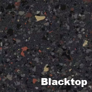 Blacktop surface with flecks of various colors: beige, red, and gray.