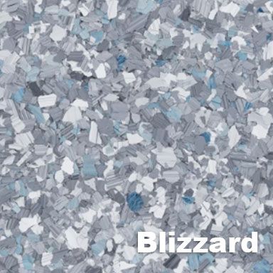 Close-up of a speckled flooring sample. The Blizzard color pattern features gray, white, and blue chips.