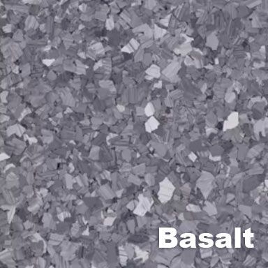 Basalt-colored epoxy flooring with flecks of dark and light gray, creating a textured surface.