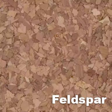 Close-up of feldspar mineral texture, various shades of beige and tan.