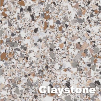 Claystone-colored epoxy flooring with flecks of brown, gray, and black on a white background.