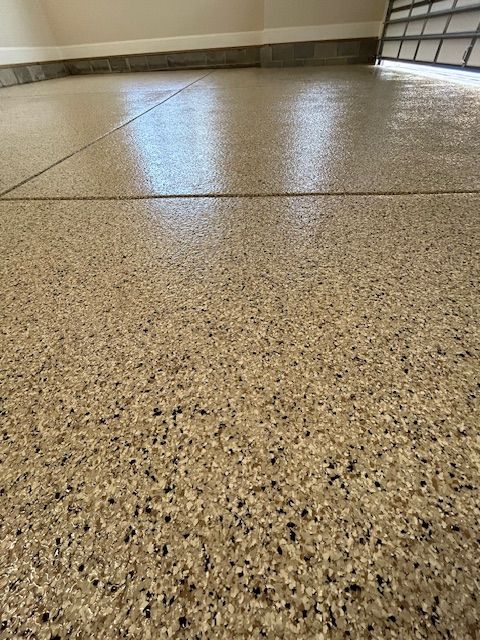 A close up of a concrete floor in a garage.