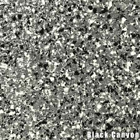 A close up of a black and white granite floor.