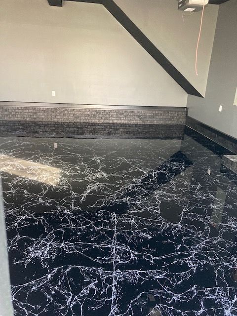 A black and white marble floor in a room