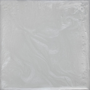A close up of a white tile with a marble texture.