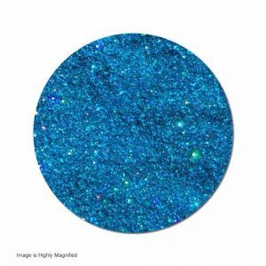 A close up of a blue glitter circle on a white background.