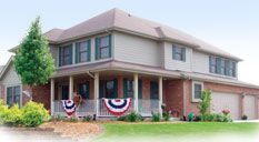 A bathroom with a toilet, shower and skylight.