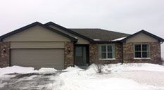 A picture of a house with a large porch