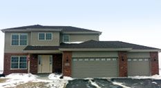 A brochure for cachey shows a white brick house